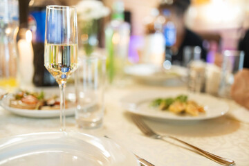 Table set for an event party or wedding reception. Empty glasses set in restaurant.
