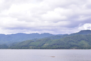 Khlong Din Daeng Reservoir Nakhon Si Thammarat, Landscape with rock, Stone yard in the grassland with mountain view