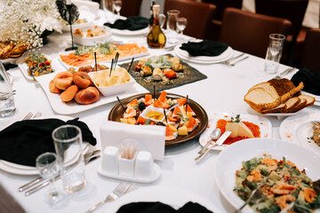 Elegant dining setup with gourmet food and a variety of dishes at a formal event