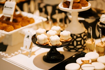Elegant dessert display featuring intricate pastries and cakes at a stylish event