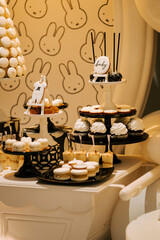 Sweet dessert display featuring cupcakes and treats for a baby shower celebration