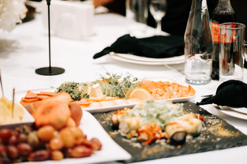 Colorful spread of appetizers and drinks at a gathering in a dining setting