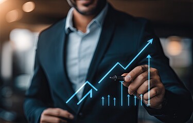 Businessman drawing upward trending graph (1)