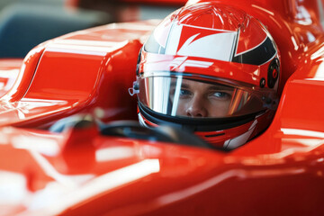 Fototapeta premium Race Car Driver in Red Helmet