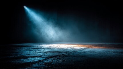 A dimly lit space illuminated by a spotlight, casting a mysterious glow on the wet surface, creating an atmospheric and dramatic effect.