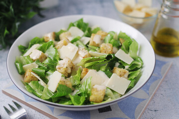 A bowl with classic Caesar salad