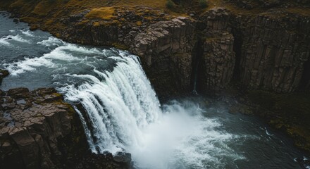 Aerial view of the majestic Dettifoss waterfall cascading through Iceland landscape