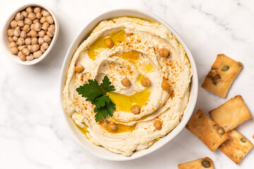 Homemade vegan hummus. Tasty vegan snack. Light background.