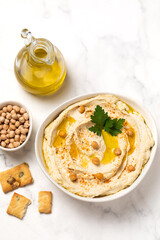 Homemade vegan hummus. Tasty vegan snack. Light background.