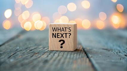 Wooden block with whats next question mark