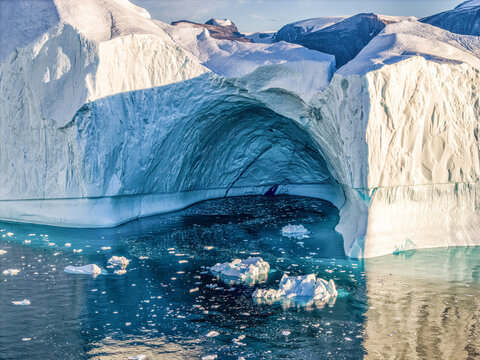 Ice cave in an ice floe. Greenland, unbelievable icy beauty in Qarajaq Isfjord