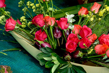 Red Roses and Vegetables on Boat