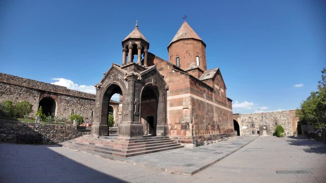 Khor Virap, an Armenian monastery with Church of the Holy Mother of God, stands majestically under a vibrant blue sky, showcasing its ancient architecture and spiritual significance