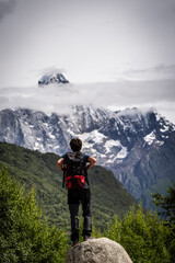 Fototapeta premium hiker in front of the Yaomei Feng summit, 6250 m. Haizigou Valley, Mount Siguniang National Park, Qionglai Mountains, Sichuan, China
