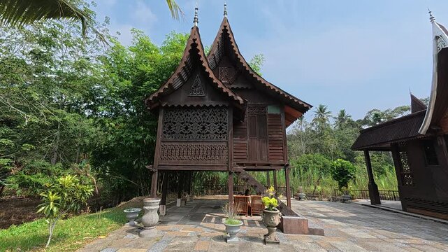 Rumah Gadang Budi is a magnificent traditional Minangkabau house. It showcases the unique buffalo horn-shaped roof, a symbol of Negeri Sembilan's rich cultural heritage.