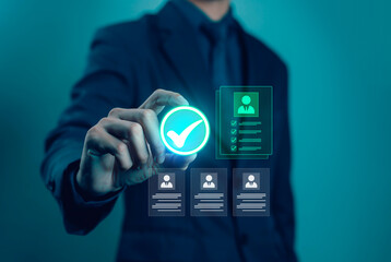 Businessman selecting digital check mark icon with resume profile, representing recruitment, job approval, candidate evaluation, human resources management, hiring process, and career opportunities.