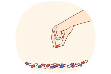 Medicinal capsules in hand of man experiencing problems with addiction to volitional drugs or antidepressants. Medicinal capsules to combat serious illness or symptoms of dangerous virus
