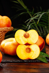 Fresh Shandong Peaches Chopped and Whole from Chinese Orchard on Rustic Wood