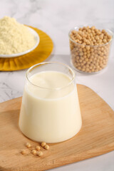 Fresh Soy Milk Made from Soybeans with Powder on Wooden Board - Healthy Plant-Based Dairy Alternative Drink