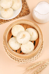 Fresh Chinese Bao Buns in Bamboo Steamer with Milk - Traditional Asian Dim Sum Breakfast