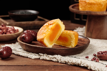 Traditional Chinese Mooncakes with Egg Yolk Filling and Red Dates for Mid-Autumn Festival Celebration