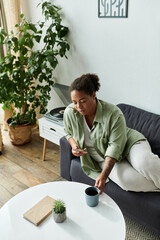 Relaxing afternoon at home for a woman in a stylish modern apartment