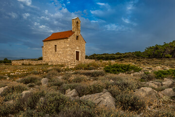 Sunset Votive Church of St. Nicholas built in 1447, sanctuary on the island of Rab, Cape Sorinja,
