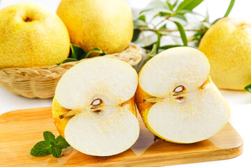 Fresh Dangshan White Pears from Anhui Province on Wooden Board with Mint Garnish