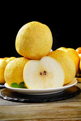 Fresh Dangshan Pears from Anhui China on White Plate Black Background Food Photography