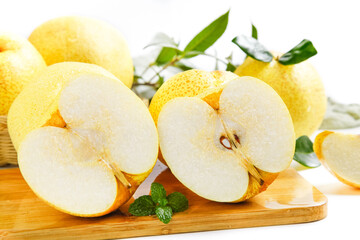 Fresh Dangshan White Pears from Anhui China Sliced on Wooden Board with Mint Leaves