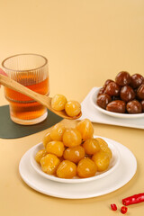 Pickled Colorful Peppers and Olives Appetizer Spread with Wooden Spoon on Beige Background