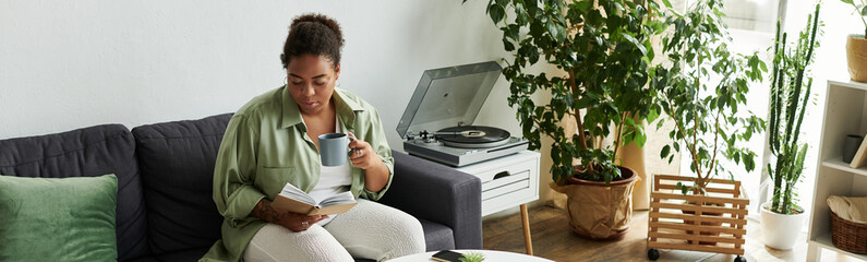 Relaxing afternoon with a warm drink and a good book in a modern apartment
