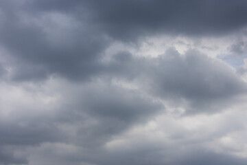 overcast sky filled with dark and light gray clouds, conveying a sense of moodiness