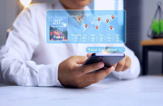 Weather forecast concept via application with a man in a white shirt using the weather application to plan a trip or organize an event