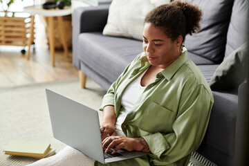 Freelancer immersed in work from home in a cozy apartment setting