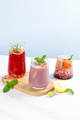 Fresh Summer Cocktails and Juices with Herbs on White Table - Refreshing Grape Drinks Cool Heat Treats