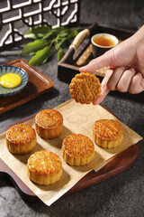 Traditional Cantonese Mooncakes with Lotus Seed Paste and Egg Yolk - Chinese Mid-Autumn Festival Pastries