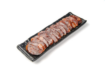 Sliced Cantonese Chinese Sausage on Black Plate White Background