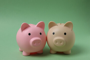 piggy bank, money dollars euros on a green background
