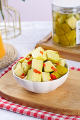 Sweet Sour Pickled Mango Guangxi China Traditional Preserved Fruit Crisp Chili Peppers White Bowl Wooden Board Old World Snack