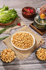 Roasted Peanuts with Fresh Vegetables and Tea on Rustic Wooden Table - Healthy Snack Food Flat Lay