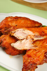 Crispy Roasted Chicken Pieces with Tender White Meat on Plate
