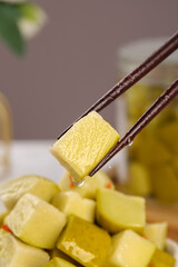 Pickled Mango Cubes with Chopsticks - Traditional Asian Sweet Sour Preserve