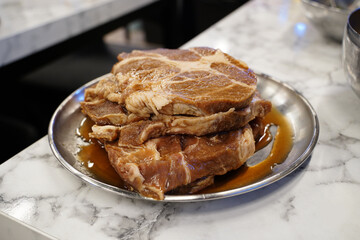 Fresh Marinated Pork on Plate, Ready for Cooking