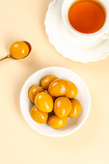 Marinated Quail Eggs in Bowl with Tea - Traditional Baked Countryman Snack