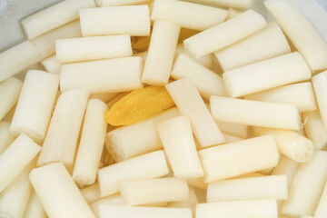 Pickled lotus root tips with sour chilli pepper slices in traditional Asian preserved vegetable preparation