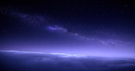 Fototapeta premium Vast night sky with Milky Way over clouds