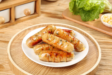 Grilled Sausages with Crispy Exterior and Fresh Vegetables on Wooden Board