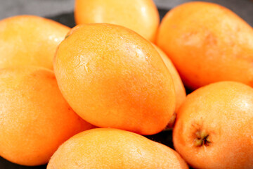 Fresh Loquat Fruits Display - Organic Golden Orange Asian Fruit Close-Up