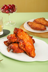 Crispy Glazed Chicken Wings with Spicy Sauce on White Plates Restaurant Style Food Photography